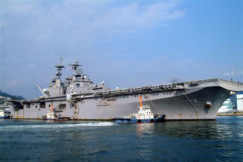 File:US Navy 061201-N-4124C-001 USS Essex (LHD 2) is pushed by tugs into her berth.jpg ...