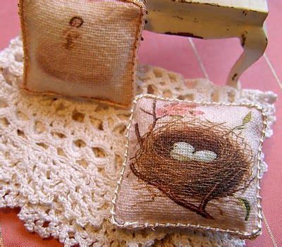 Two Small Pillows Are Sitting On A Doily