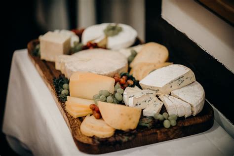 Assorted Cheese on a Wooden Platter · Free Stock Photo