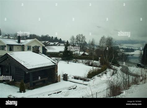 Southern Norway, winter scene of village by water Stock Photo - Alamy