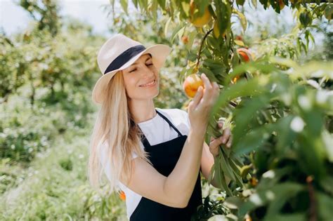 Premium Photo Woman Harvesting Fruits