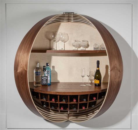 A Wall-Mounted Bar Cabinet Inspired by a Spinning Coin