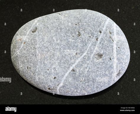 Tumbled Greywacke Sandstone On Dark Background Stock Photo Alamy