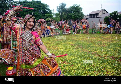 Girls In Traditional Dress Dancing Dandiya Raas Garba Traditional Folk