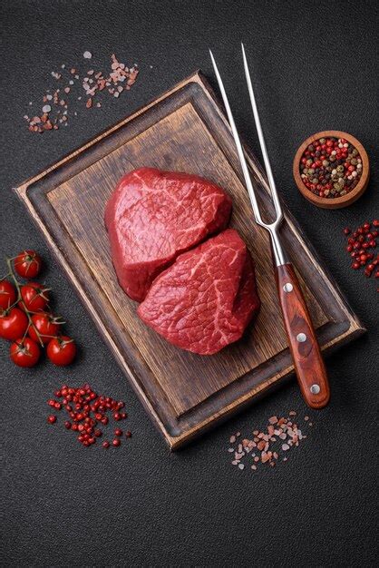 Premium Photo Fresh Juicy Raw Beef Medallions With Salt And Spices On