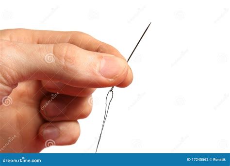 Sewing needle in hand stock photo. Image of textile, black - 17245562