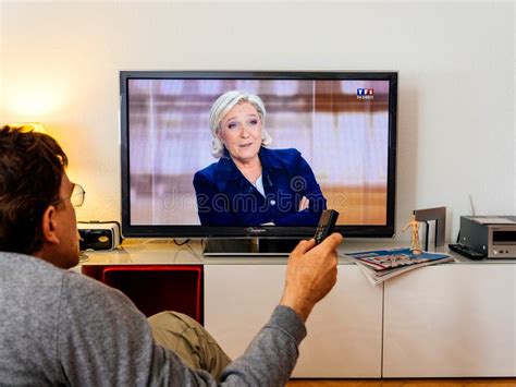 Candidate Supporter Watching Debate Between Emmanuel Macron And