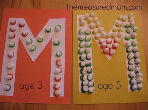 The Letter M Is Made Out Of Marshmallows And Sits Next To Each Other