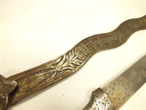 An Indian Sword 735cm Wavy Blade Decorated To Either Side With