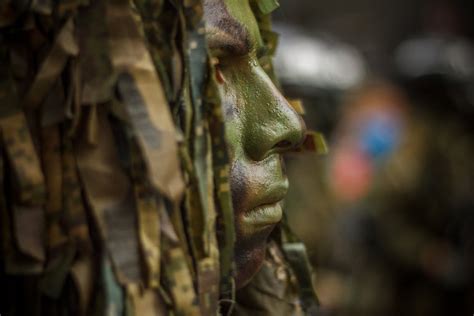 Close Up Photo of Soldier With Face Paint · Free Stock Photo