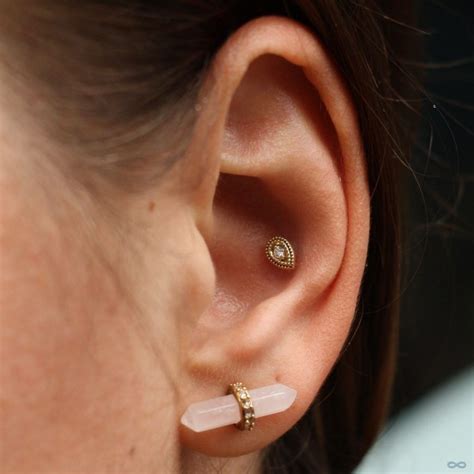 Conch Piercing By Andru With A Double Millgrain Pear Press Fit End