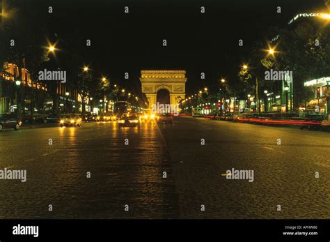 A Night Time View Along The Champs Elysees Towards The Arc De Triomphe