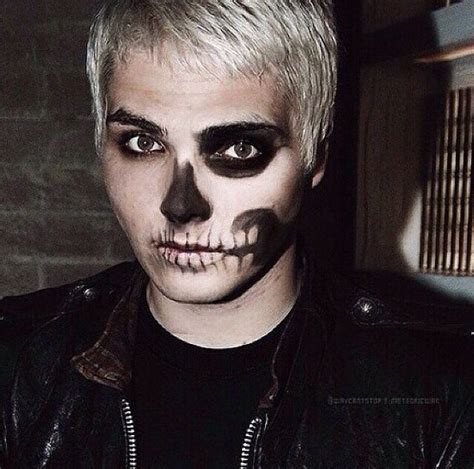 A Man With White Hair And Black Makeup