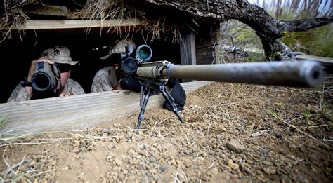 Marines Work As A Sniper Spotter Team To Assess Targets Down Range Using The M110 Semi Automatic