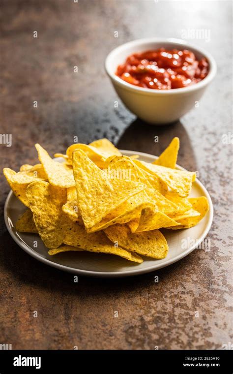 Tortilla Chips And Red Tomato Salsa Dip Mexican Nacho Chips On Brown