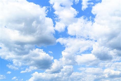 Premium Photo White Clouds In A Bright Blue Sky The Beauty Of The