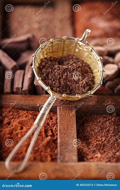 Hot Chocolate Flakes In Old Rustic Style Silver Sieve On Wooden Stock