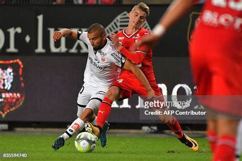 Dijon's Tunisian midfielder Naim Sliti vies with Rennes' French... News ...