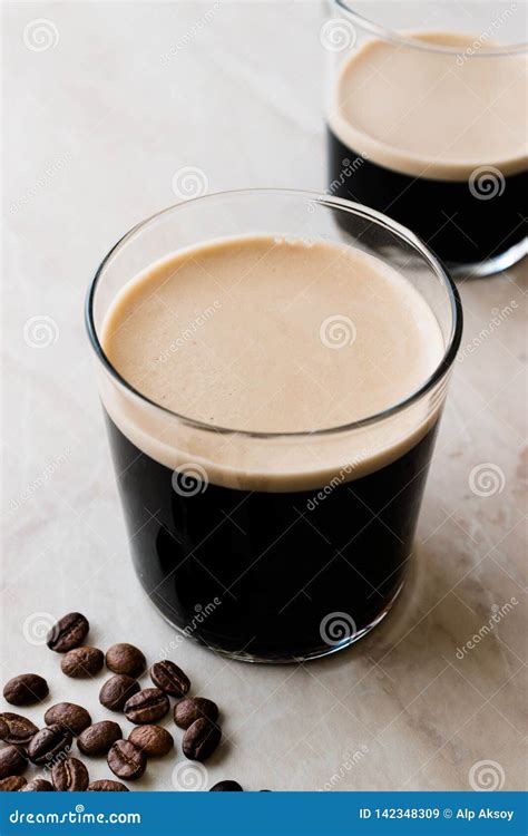 Frothy Cold Brew Nitro Coffee With Beans Ready To Drink Stock Image