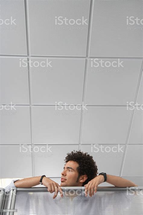 Office Worker Peering Over Cubicle Wall Stock Photo Download Image