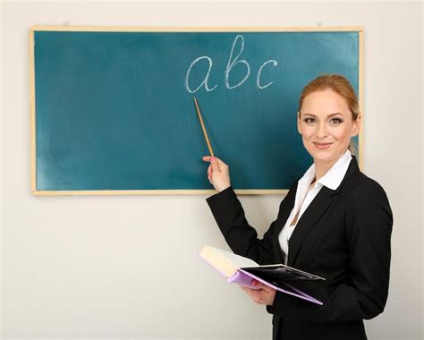 Premium Photo Portrait Of Teacher Woman Near Chalkboard In Classroom