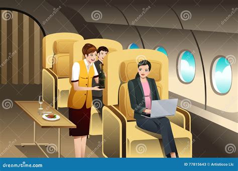 First Class Passengers Being Served By The Flight Attendant Stock