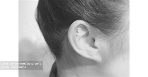 Micro Crescent Moon And Star Tattoo Placed On The Ear