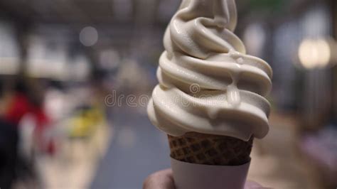 Soft Serve Ice Cream Cone Is Melting In Hand Stock Photo Image Of