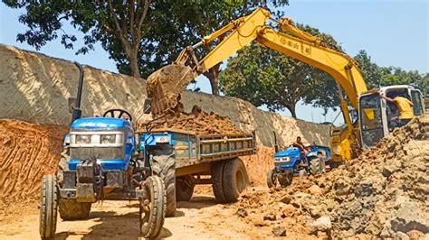 JCB 3dx Backhoe Loading Black Mud In Sonalika Di Duable 35 Rx Tractor