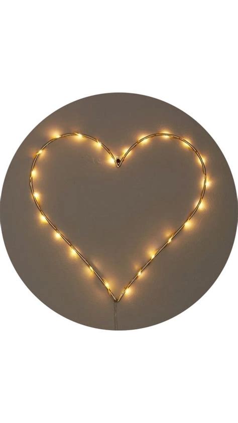 A Heart Shaped Light Up Decoration On A Wall