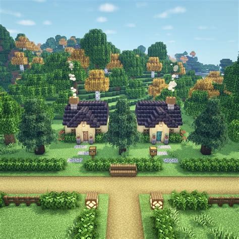 A Small Village In The Middle Of A Green Field With Lots Of Trees And