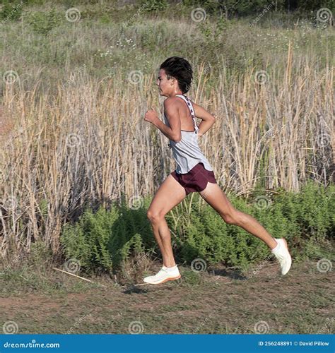 Amerasian Teenage Boy Running in a 5K Cross Country Race in Oklahoma