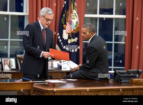 President Barack Obama confers with Chief of Staff Denis McDonough in ...