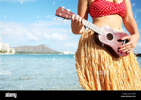 Hawaii Oahu Waikiki Hula Dancer Playing Ukulele Along Beach Stock