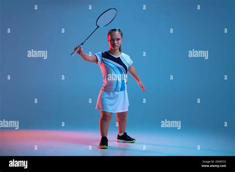 Action Beautiful Dwarf Woman Practicing In Badminton Isolated On Blue