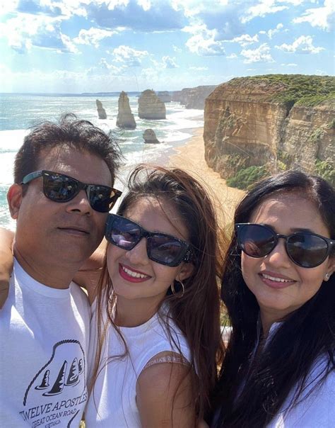 Two Women And A Man Taking A Selfie In Front Of The Great Ocean Road