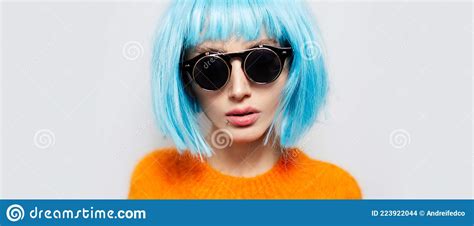 Blue Haired Girl In A Hat Sitting Cross Legged Meditating Near Ramboda