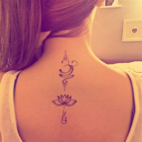 Upper Back Tattoo Of A Om And A Lotus Flower On Maria