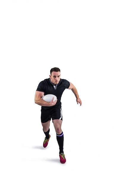 Jugador De Rugby Corriendo Con La Pelota Foto Premium