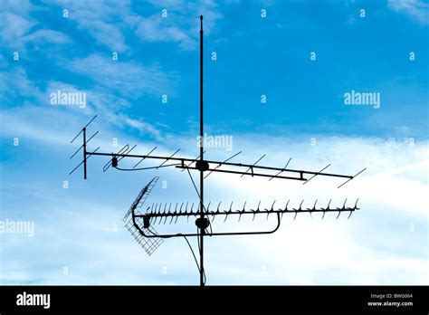 old analog television antenna against blue sky Stock Photo - Alamy