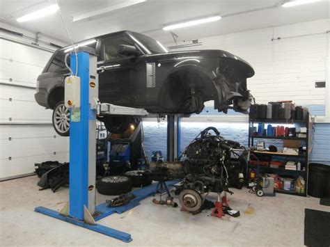 A Car Being Worked On In A Garage