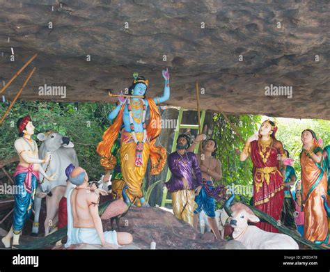 Colorful life size idols of Krishna with Govardhan Parvat or hill at Prem Mandir temple. Happy ...