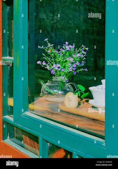 A Vertical Shot Of Turquoise Window Frame Showing The Interior Of A