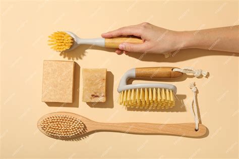 Premium Photo Two Bars Of Soap Brushes And Hand On Beige Background