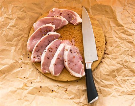 Fresh Raw Pork Chops On A Cutting Board Arrangement On The Wr Stock