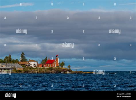 Eagle Harbor Lighthouse On The Shore Of Lake Superior In The Upper