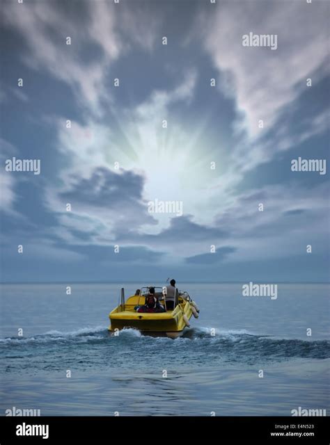 Boat at ocean and sunset Stock Photo - Alamy