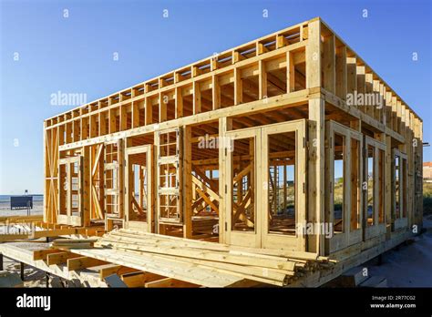 New unfinished natural wood cafe building framework and terrace floor ...