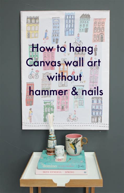 Hang a canvas on a wall without hammer and nails