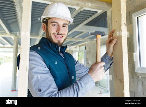 Man Building A House And Working With Hammer Stock Photo Alamy